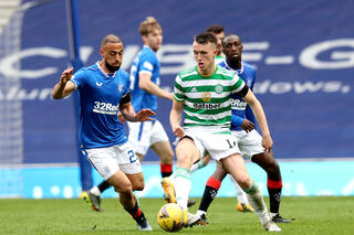 Rangers' Kemar Roofe (left) and Celtic's David Turnbull battle for the ball during the Scottish Cup fourth round match at Ibrox, Glasgow. Picture date: Sunday April 18, 2021. Use subject to restrictio