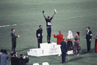 Tommie Smith, John Carlos and Peter Norman during the award ceremony of the 200 m race. The american sprinters Tommie Smith, John Carlos and Peter Norman during the award ceremony of the 200 m's race
