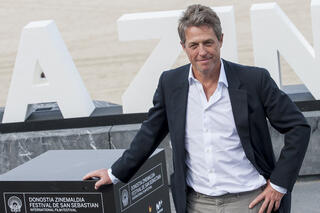 British actor Hugh Grant poses for a photocall after the screening of his film "Florence Foster Jenkins"