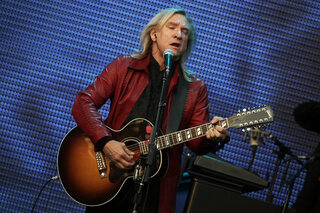 Member of fhe Rock band 'Eagles' Joe Walsh performs on stage at the band's first concert of the German tour at the 'Bowling Green' in Wiesbaden, Germany, 19 June 2011. The Eagles started their tour un